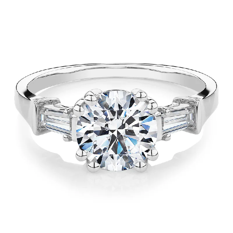 Round Brilliant and Baguette shouldered engagement ring with 2.46 carats* of diamond simulants in 10 carat white gold